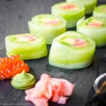 Naruto Rolls Cucumber Sushi Rolls on a black stone plate.