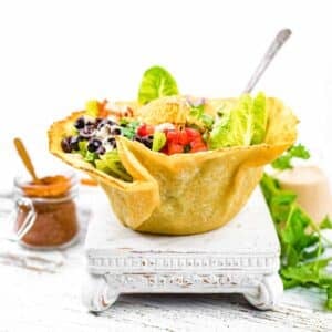 Keto Taco Salad Recipe with Ground Beef on a white stand.