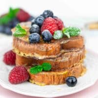 Low Carb French Toast with syrup and berries.