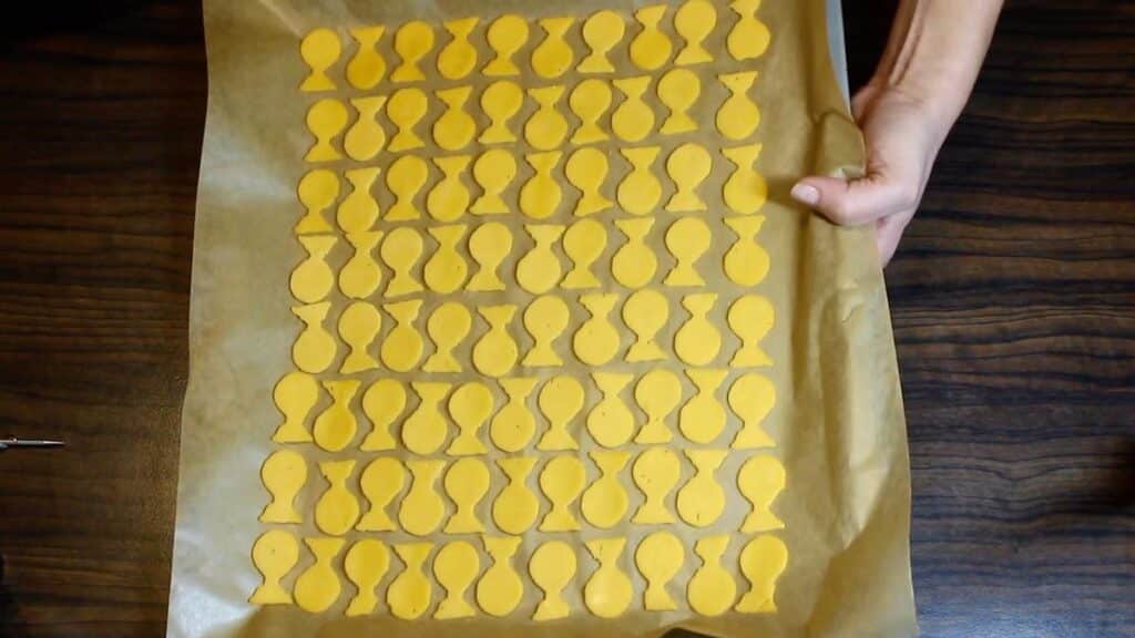 Keto Goldfish Crackers drying on a baking sheet.