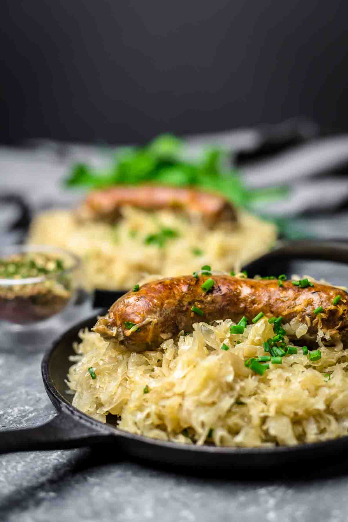 German Sausage Recipe with sauerkraut in a pan.