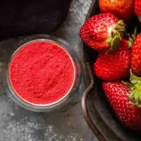Strawberry Powder with fresh strawberries.
