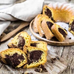 Pieces of keto bundt cake on a wooden board.