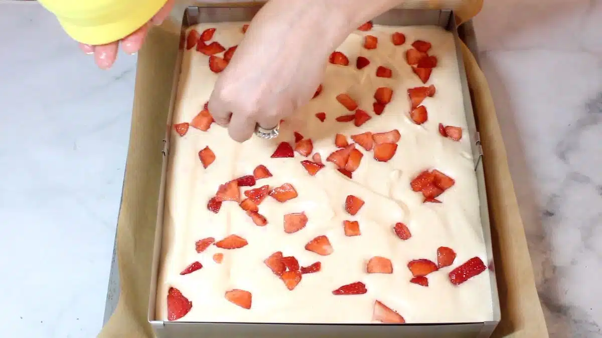 Keto Friendly Cake adding strawberry pieces in.