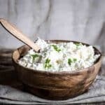 wooden bowl of farmers cheese.