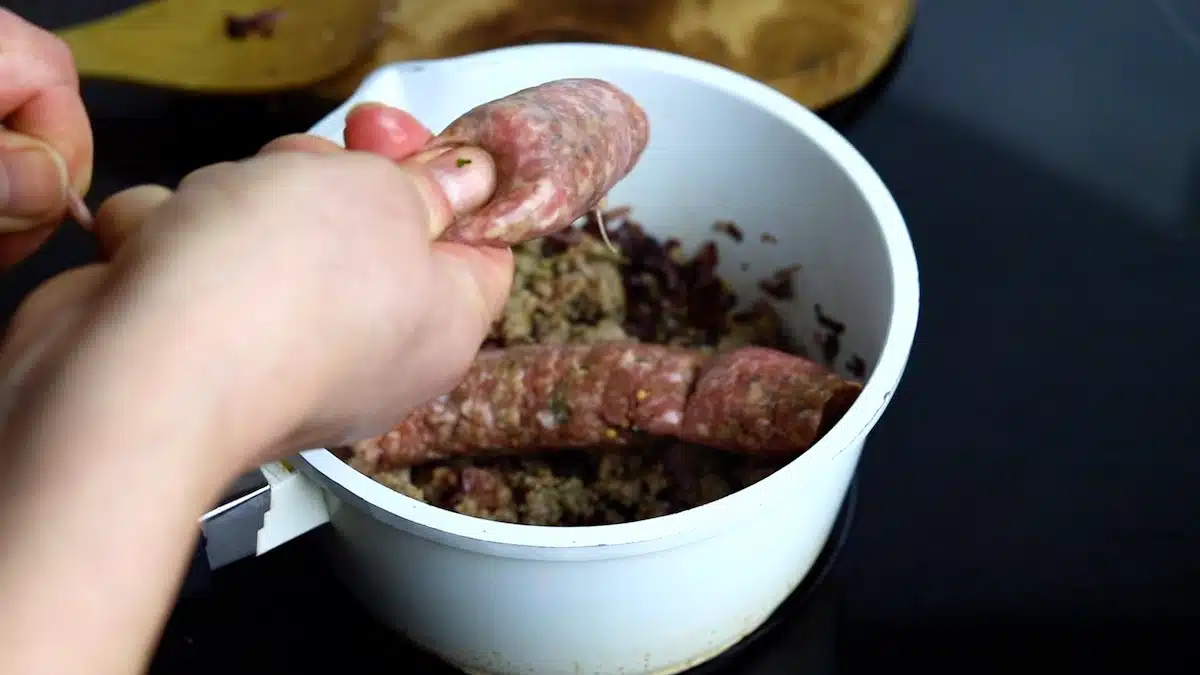 Keto Sausage Gravy coking homemade sausage.