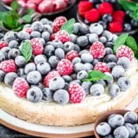 cheesecake with frozen berries on top.