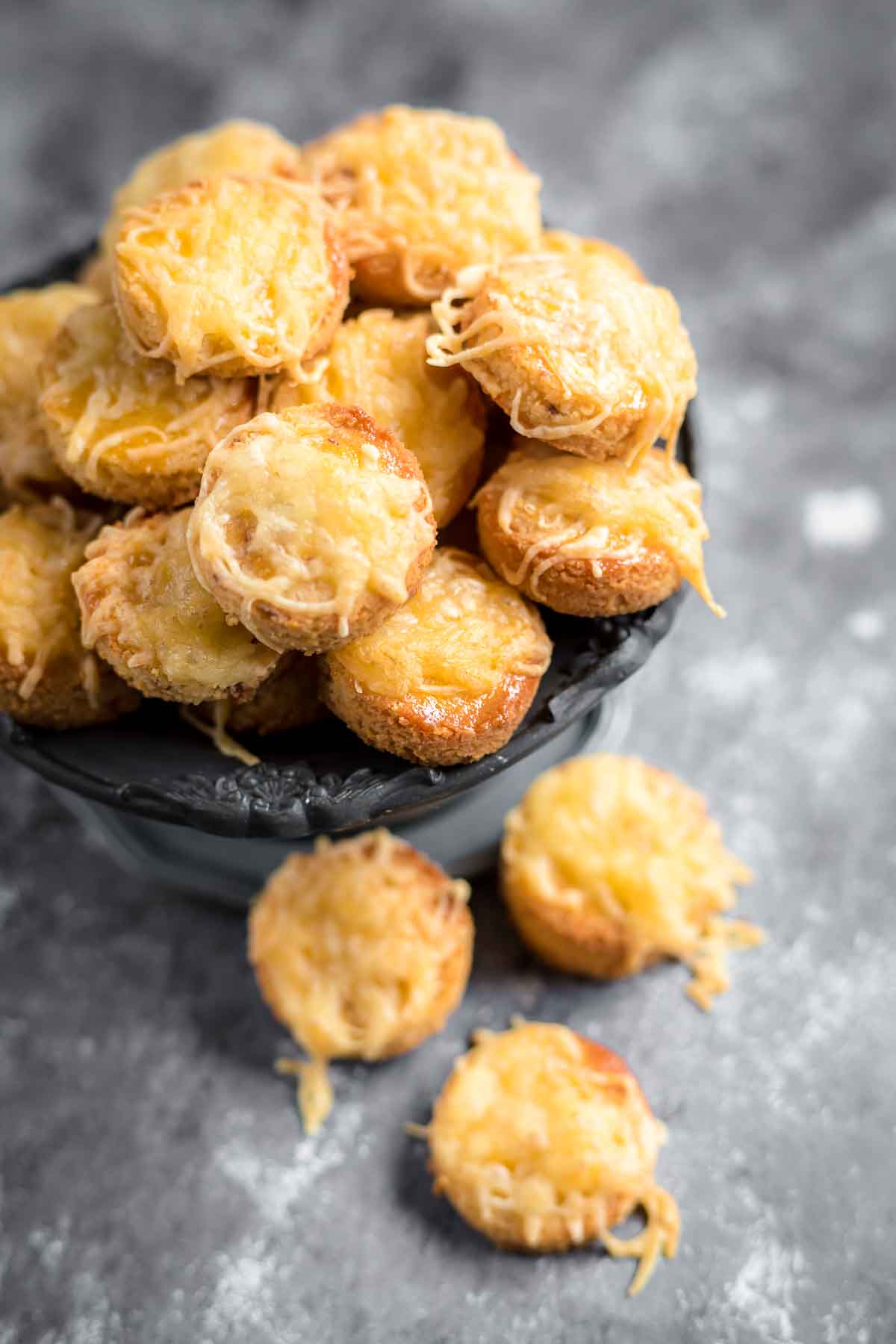 Keto Biscuit Bites with baked cheese on top.