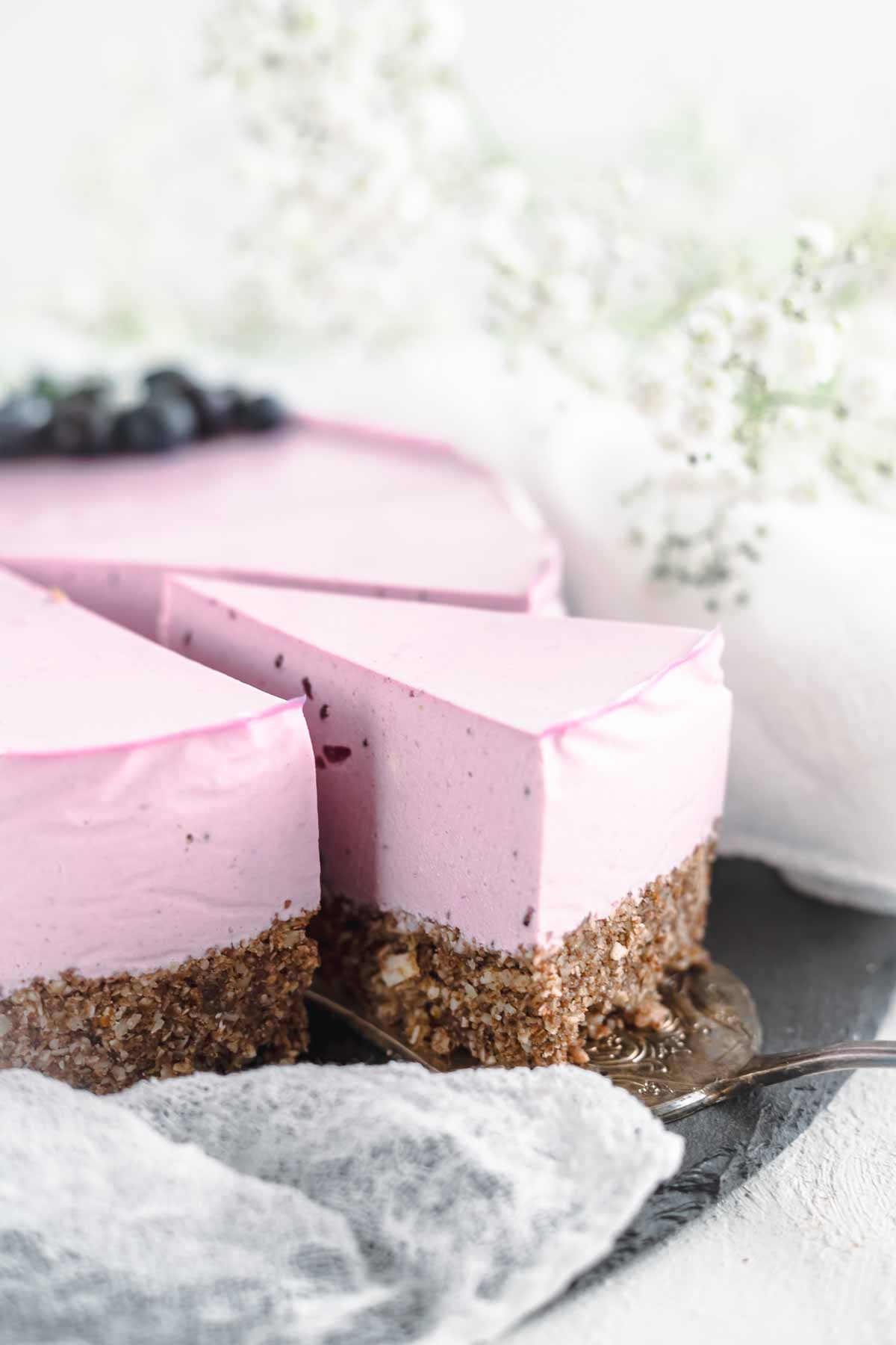 Blueberry No Bake Cheesecake on a stone board.