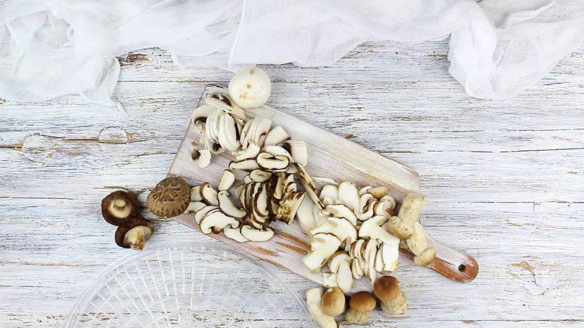 Fresh Mushrooms on a wooden board.