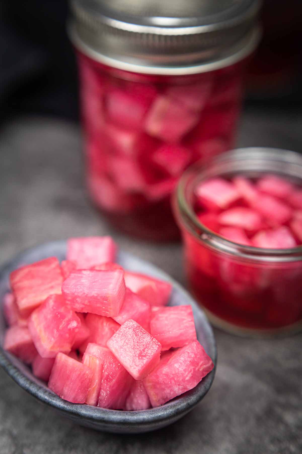 Pickled radish flavored with beetroot in a bowl.