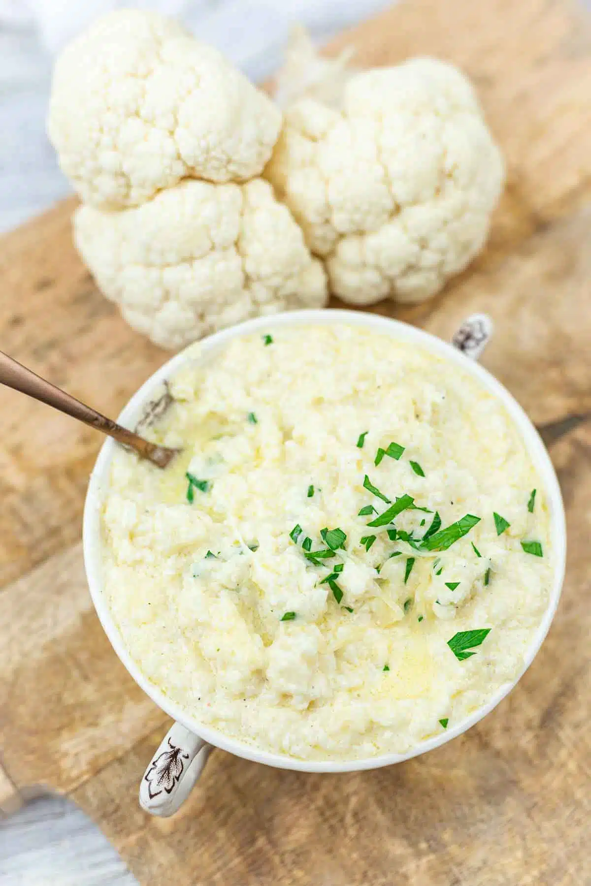 Riced cauliflower with cheese in a soup bowl.