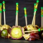 Wrapped Brussels sprouts cut in half.