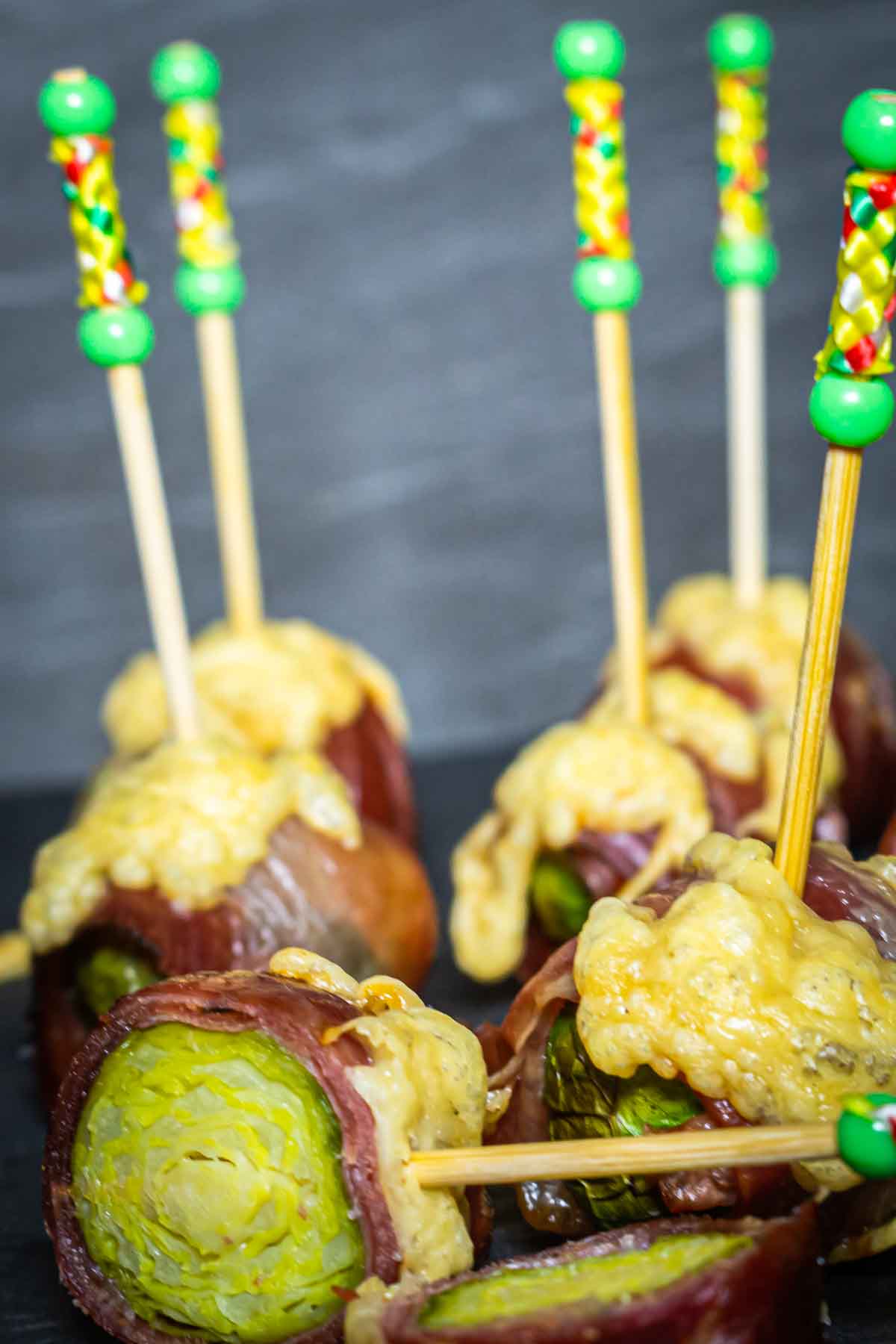 Brussels sprouts wrapped in bacon on a stick.