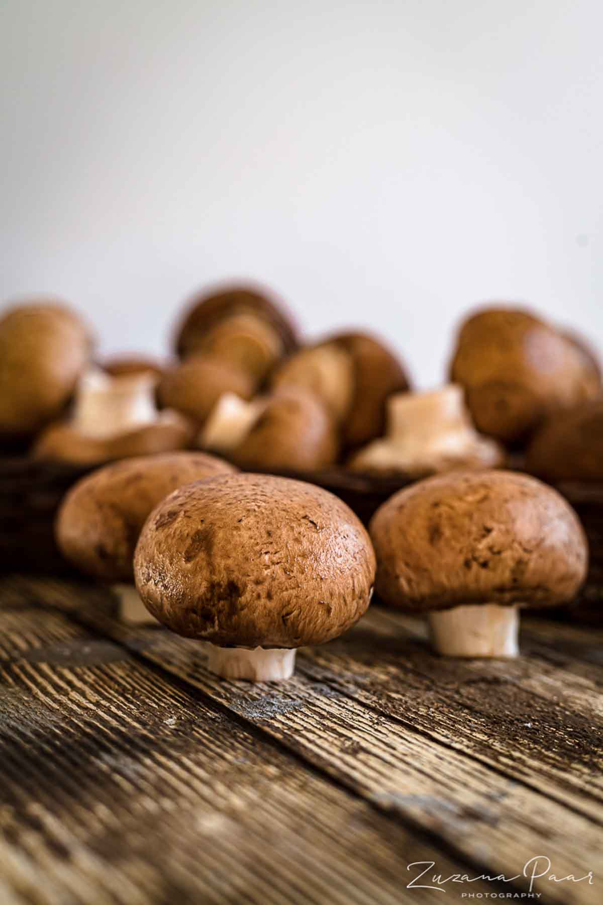 Fresh mushrooms on a wooden board.