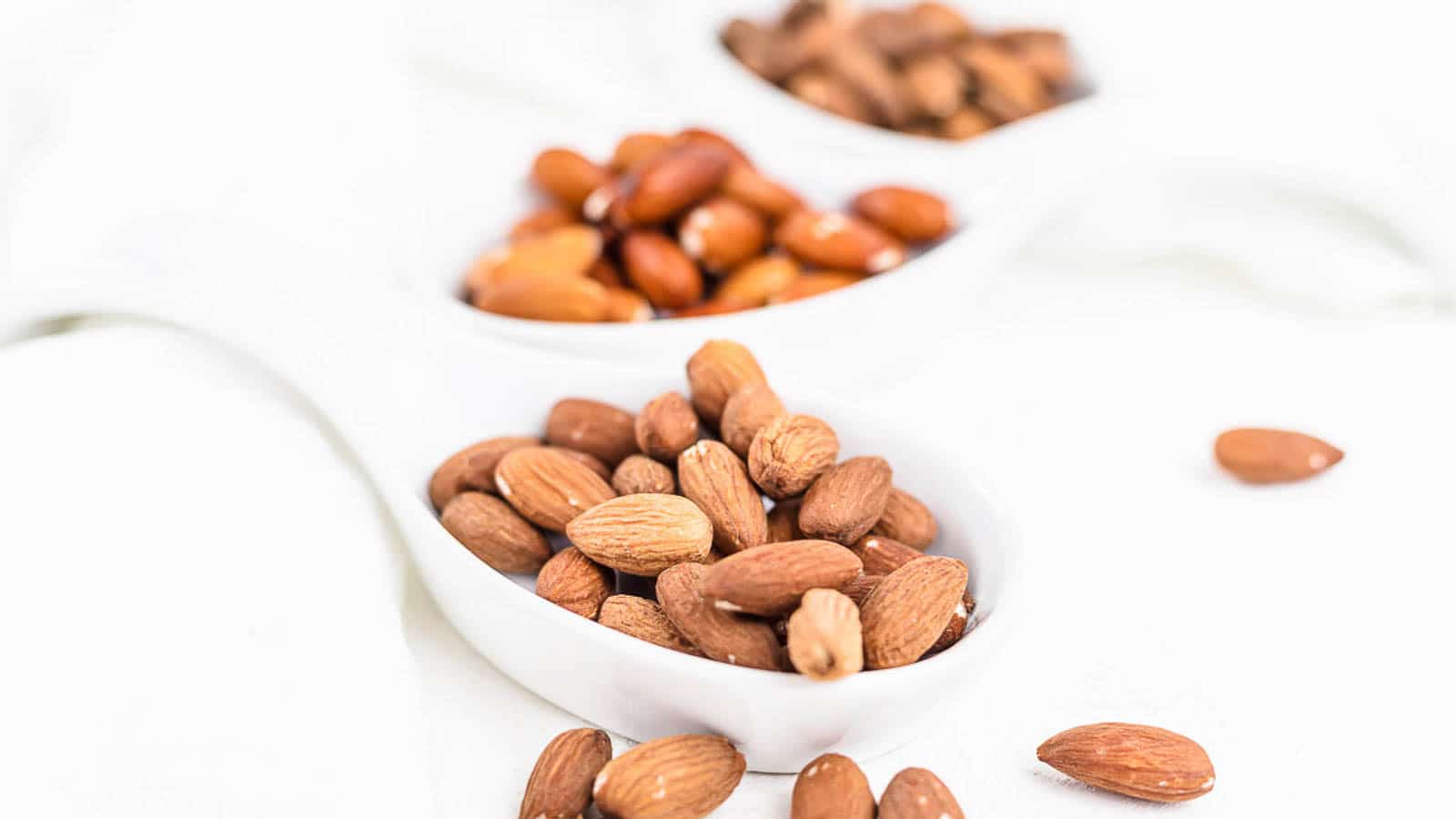 Activated Almonds inside white plates.