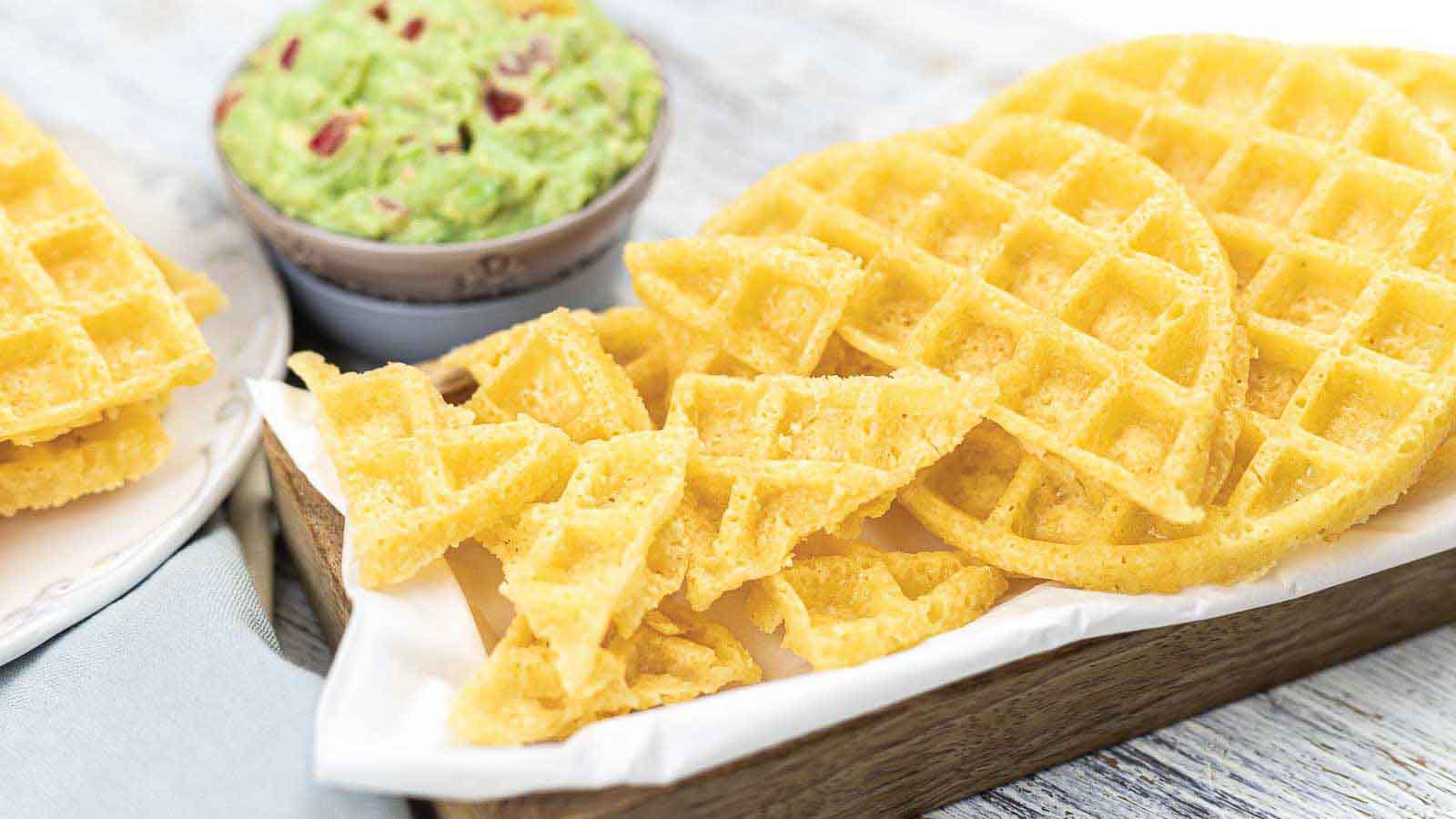 A plate of chaffles with guacamole.