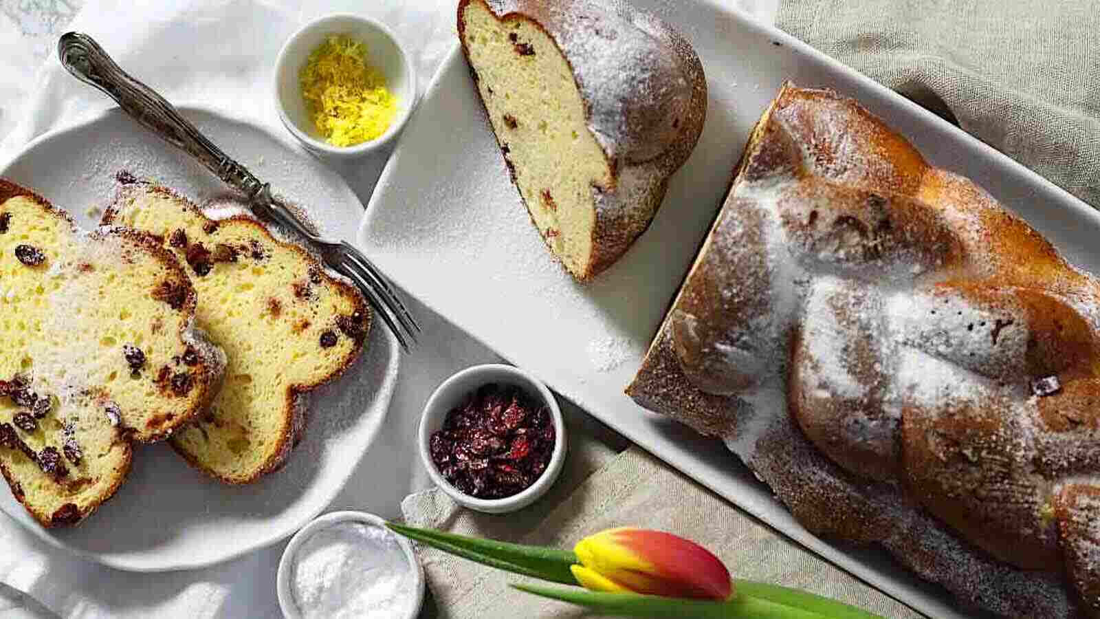 Sweet Keto Challah Bread on a white plate with tulips.