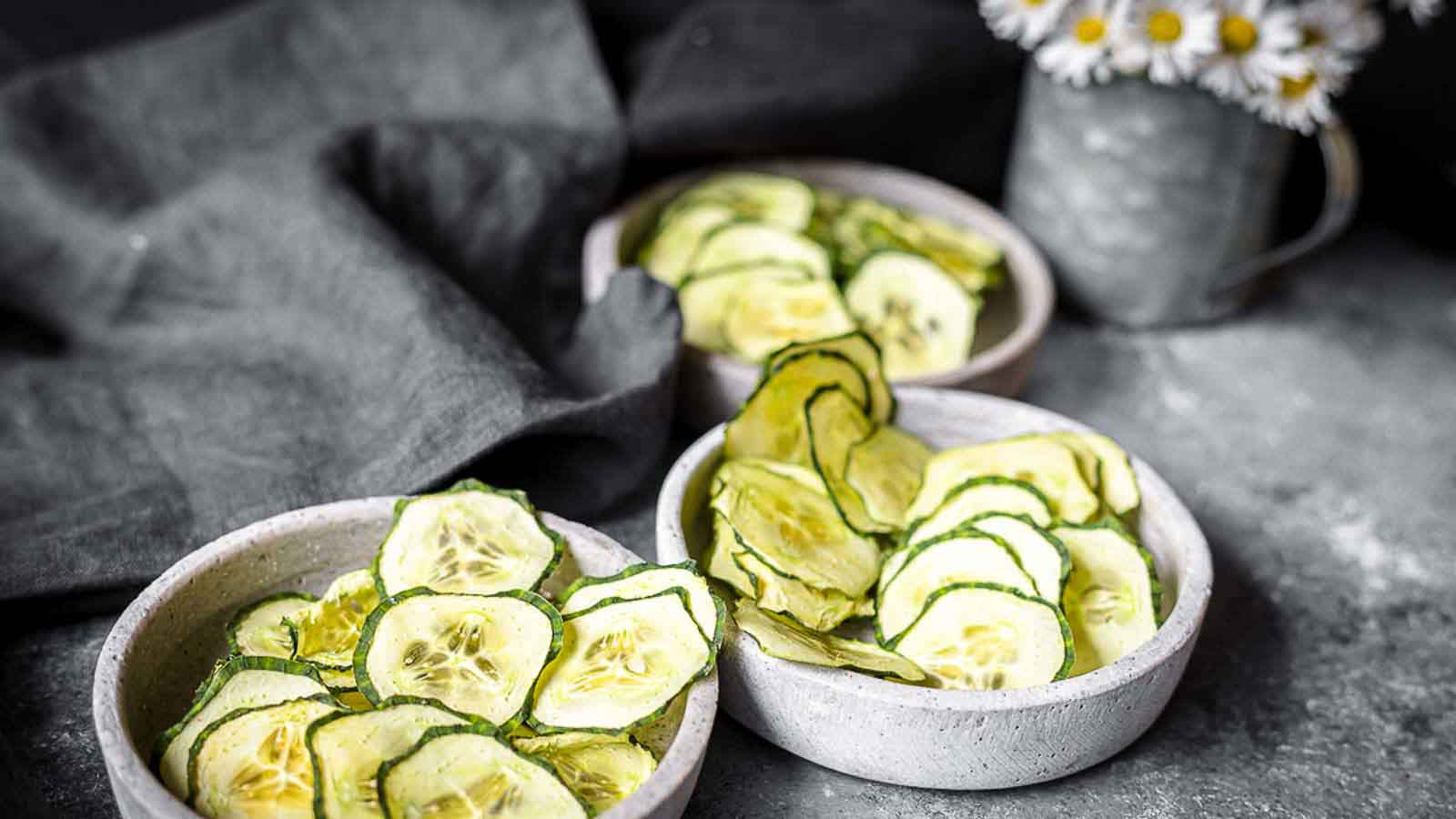Cucumber Chips inside 3 stone bowls.