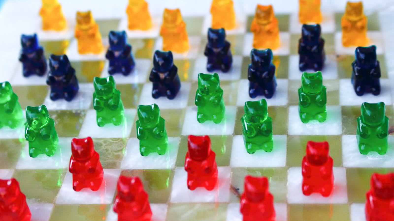 Gummy Bears on a checkered board. 