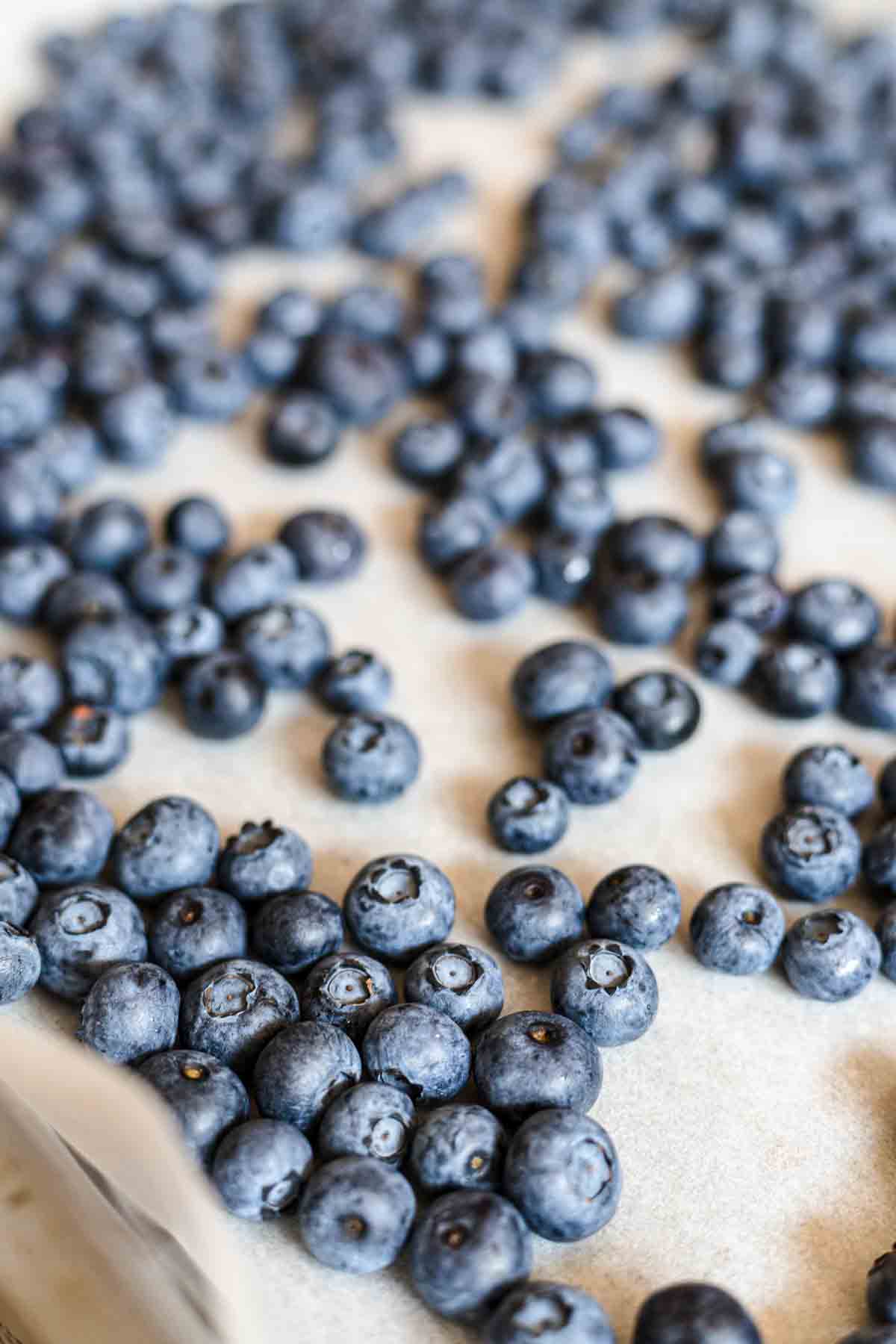 Blueberries on a baking sheet.
