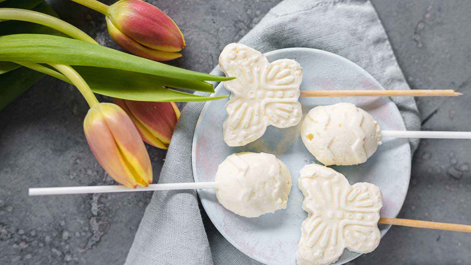 Mini Popsicles on a plate with tulips.