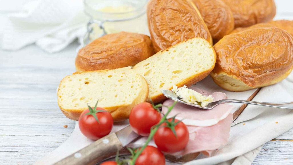 Protein Buns sliced with toppings for breakfast.