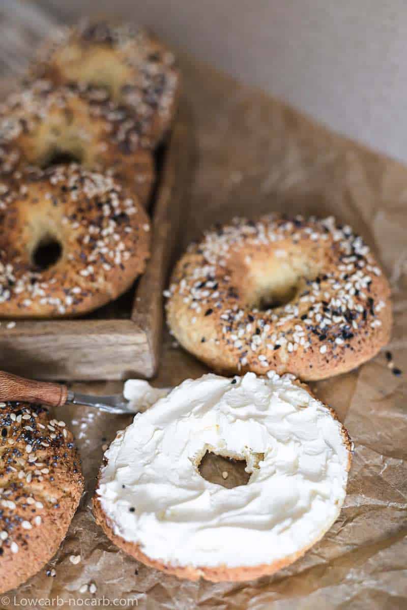 Bagels with cream cheese and sesame seeds.