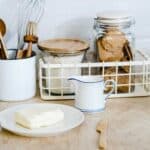 A plate of cream cheese on a kitchen counter.