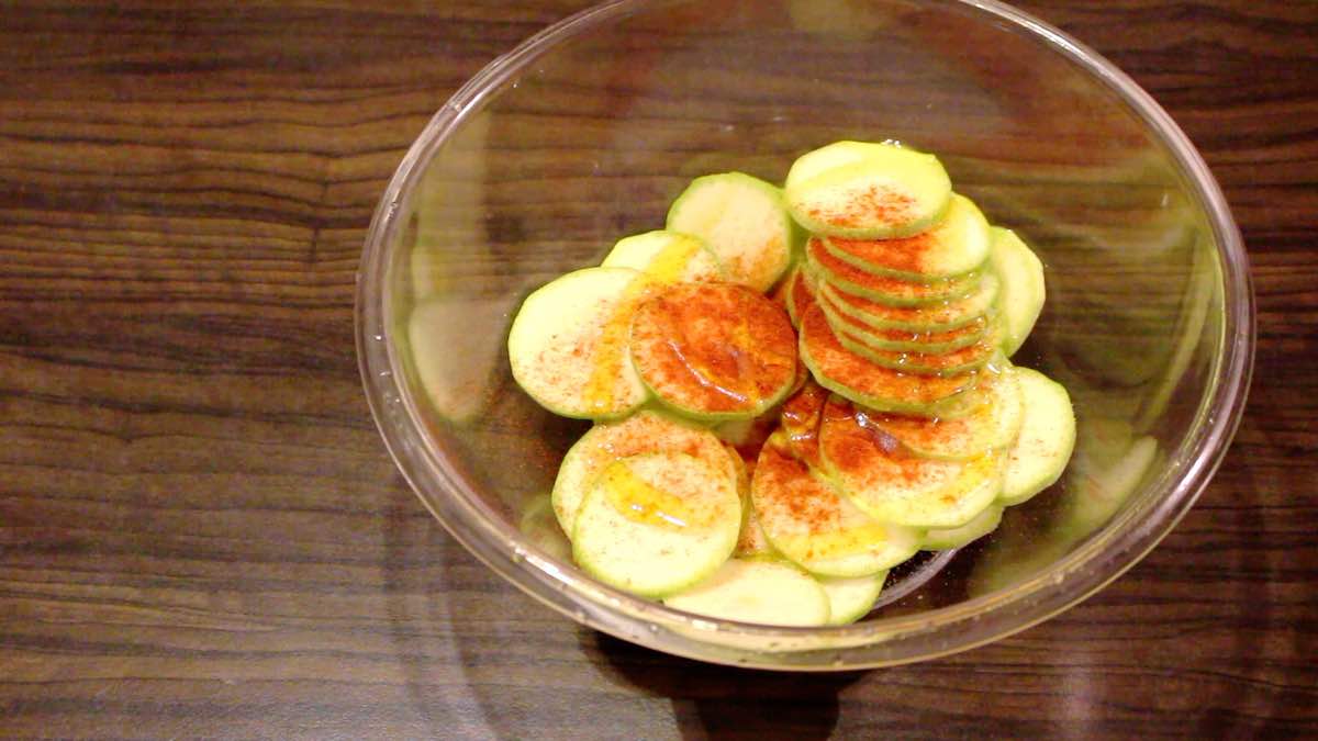 Sliced zucchini in a bowl.