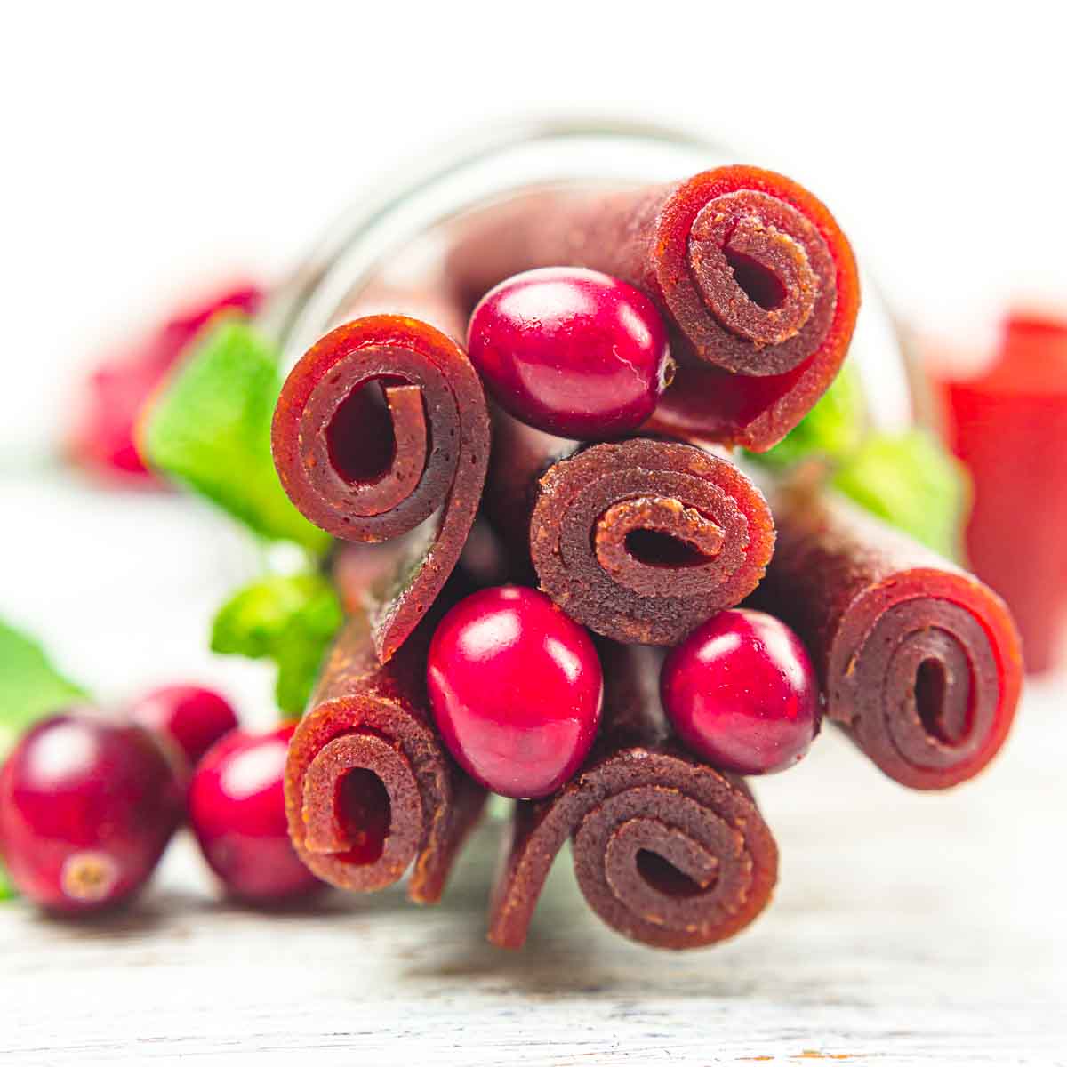 A jar with cranberry leather.