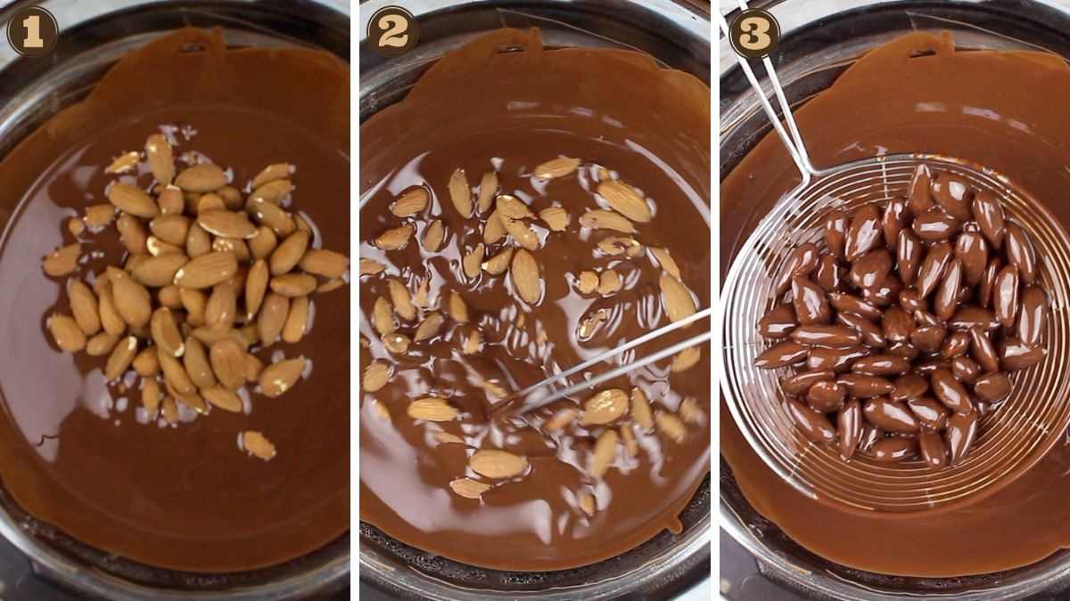 Dipping almonds into melted chocolate.