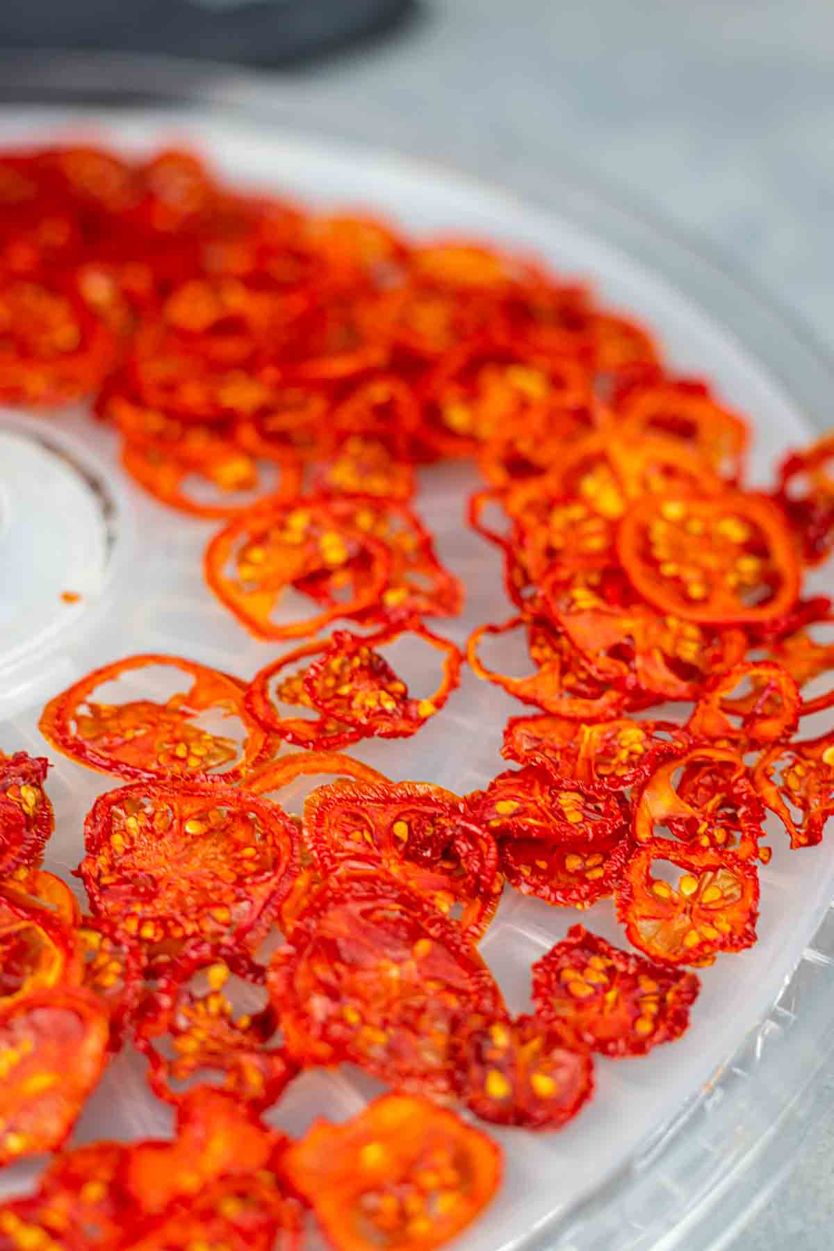 A tray of dried tomatoes on a table.