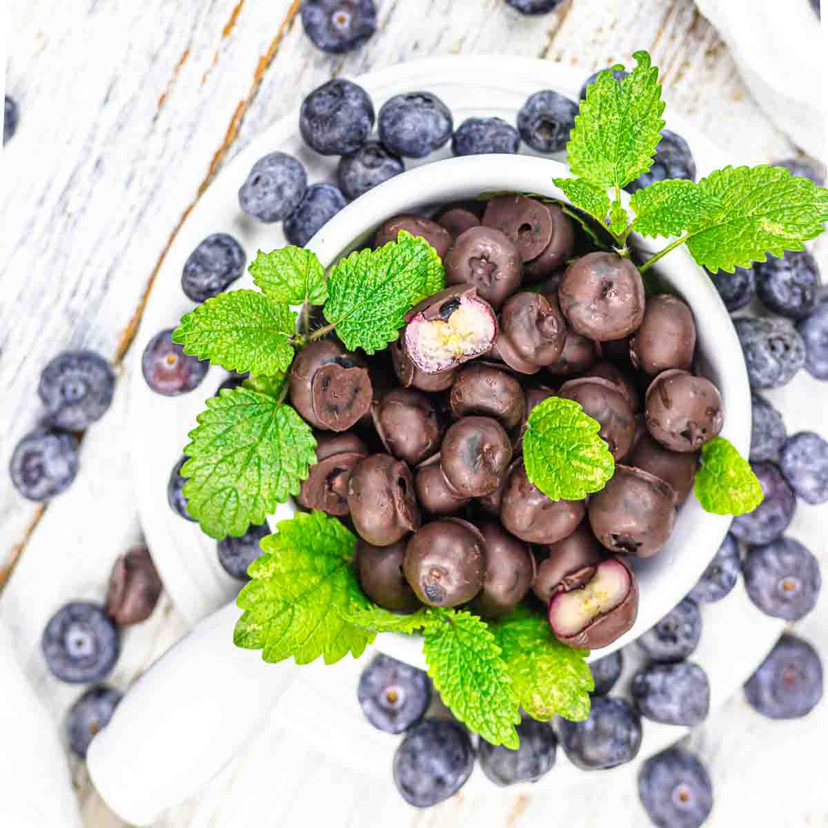 Chocolate and blueberries in a cup.