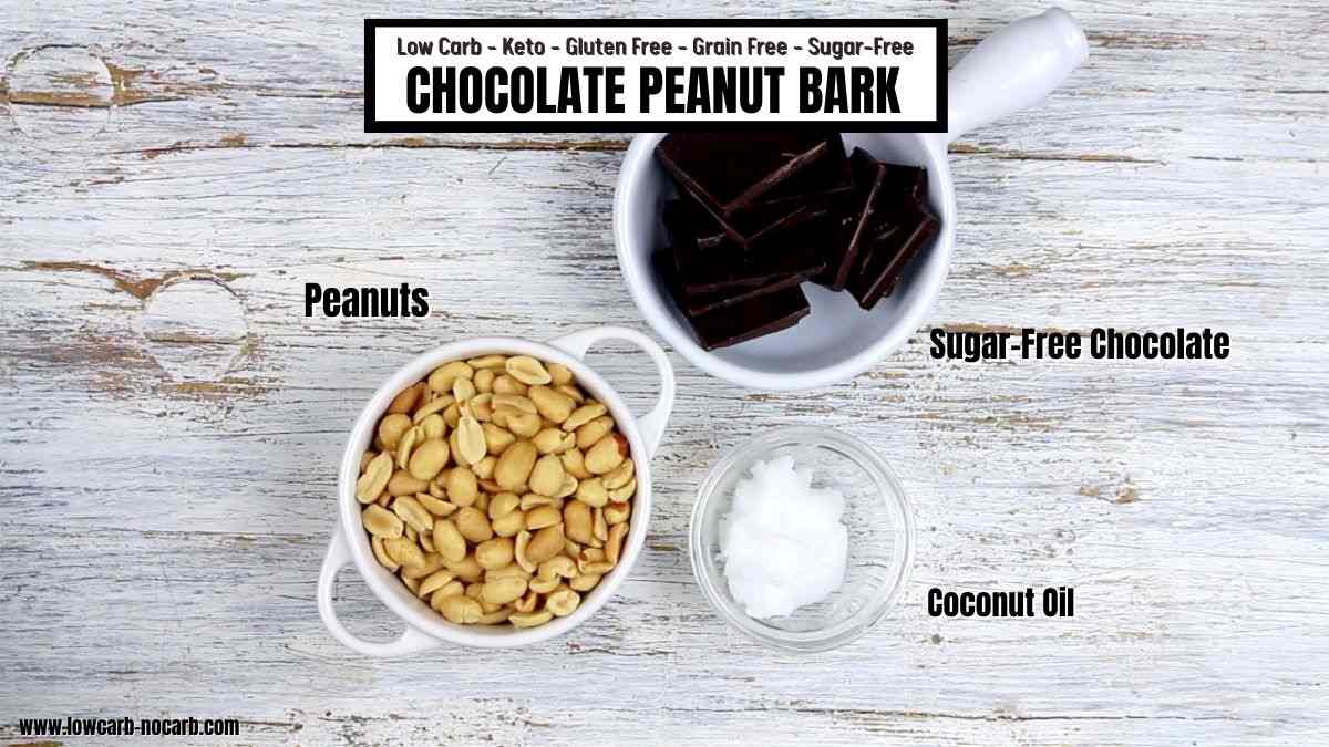 Ingredients for chocolate peanut bark laid out: peanuts, sugar-free chocolate, and coconut oil, on a wooden background with text detailing the recipe's dietary properties.