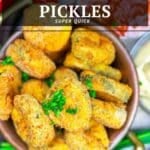 A bowl of air fried dill pickle slices garnished with chopped chives, with a dip and green onions in the background.