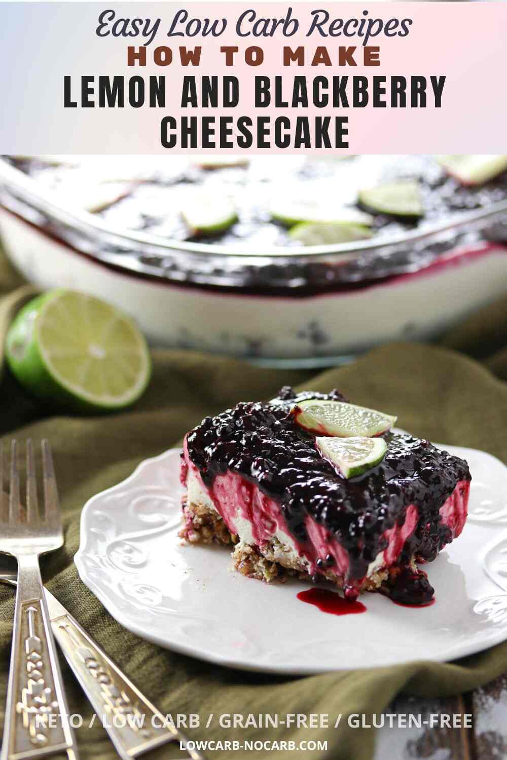 A slice of lemon and blackberry cheesecake topped with lime slices is served on a white plate; the whole cheesecake is in the background.