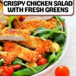 A bowl of crispy chicken salad with fresh greens, sliced cherry tomatoes, and arugula, with recipe instructions at the top of the image.