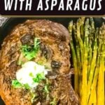 Prime rib steak topped with sour cream and chopped herbs, served with a side of roasted asparagus on a black plate.