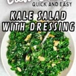 A white bowl filled with chopped kale salad topped with dressing and sliced almonds, with a spoon resting inside. Text on image reads “Low Carb Quick and Easy Kale Salad With Dressing.”.