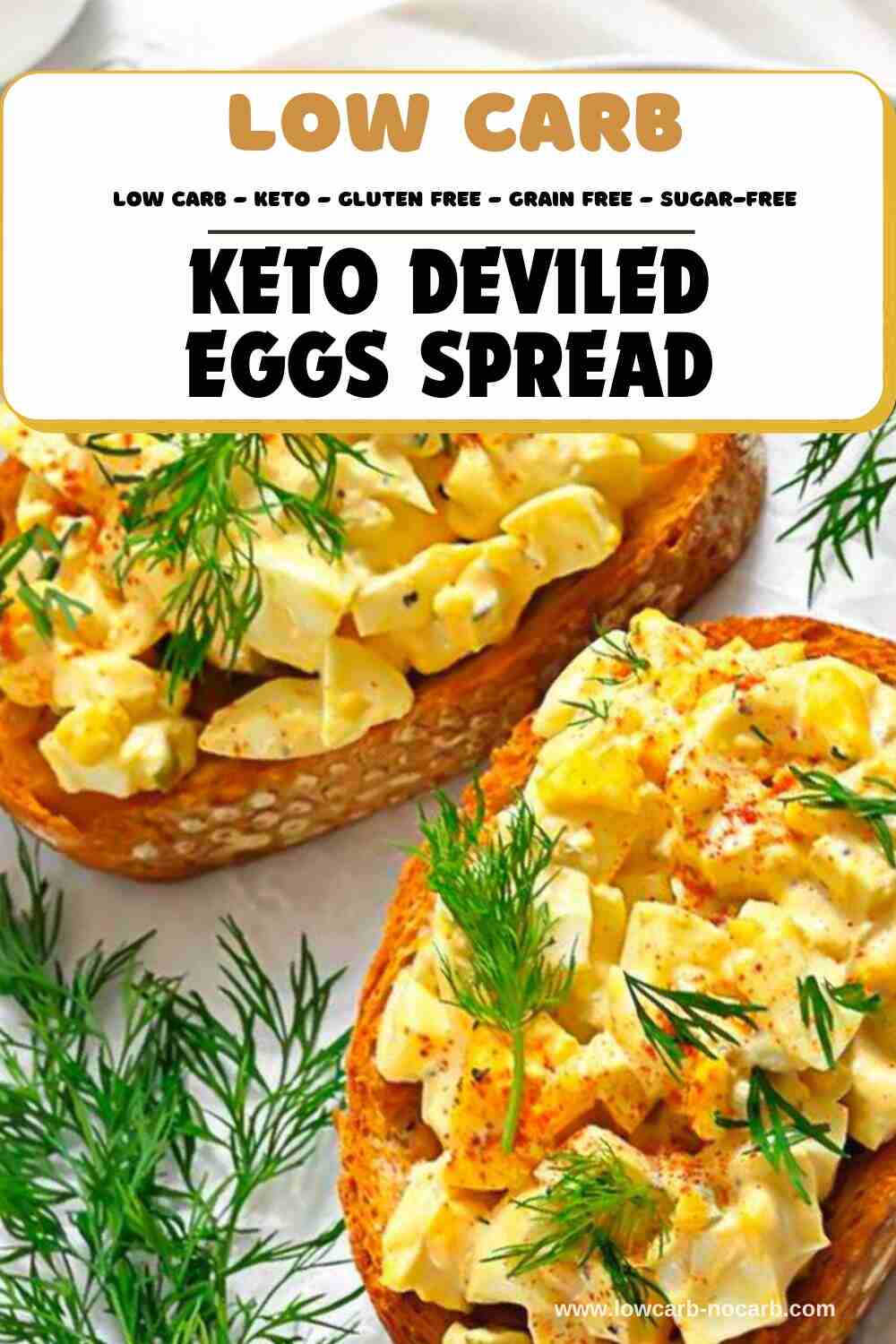 Two slices of bread topped with keto deviled egg spread and garnished with fresh dill, surrounded by extra dill on a white surface.