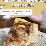A slice of low carb cheesecake with mock apple crumb topping on a decorative white plate with a fork. Text overlay reads: “Quick and Easy Low Carb Cheesecake with Mock Apple Crumb.”